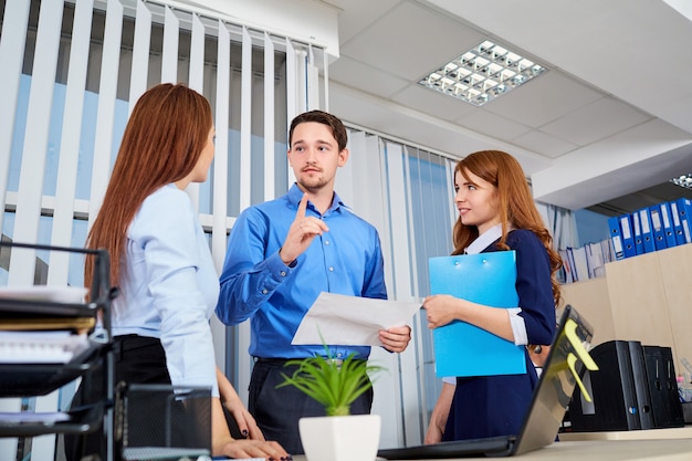 Business team in an office communicating with documents