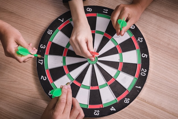 Business team pointing to a darts aiming at the target center business,Targeting the business concept