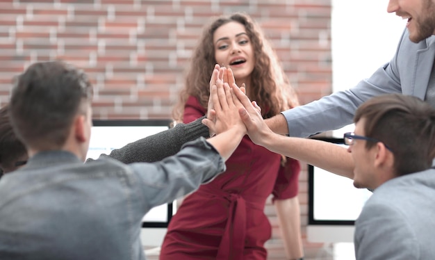 Business team showing unity with their hands together