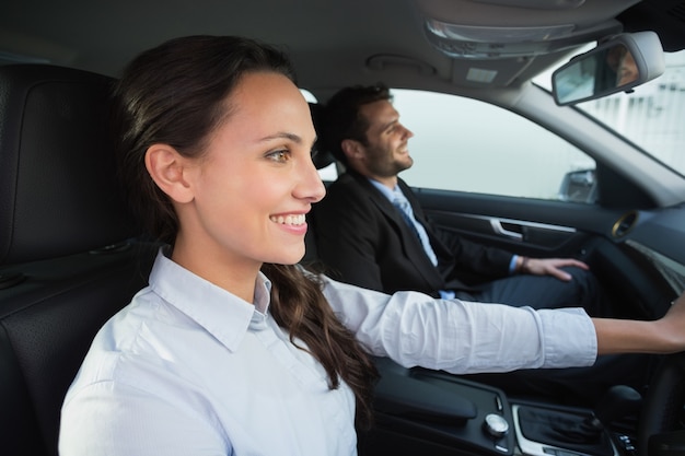 Business team smiling and driving