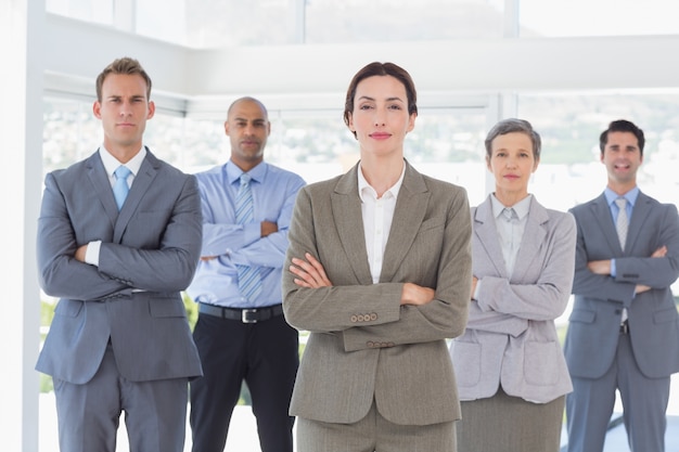 Business team standing arms crossed