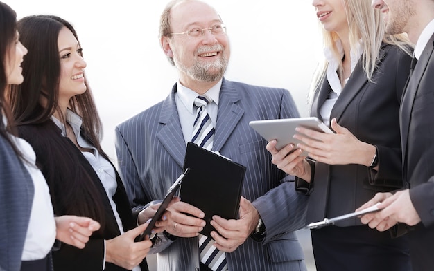 business team standing talking in the office.