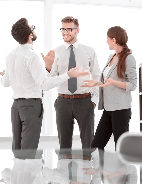 Business team talking in an empty office