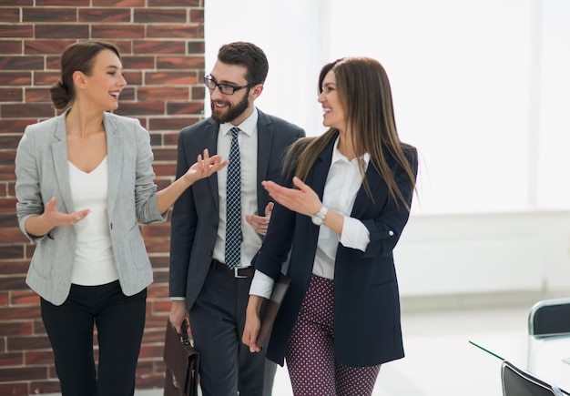 Business team talking standing in the office