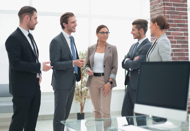 Business team talking standing in the officeoffice weekdays