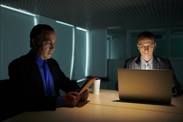 Business Team Working in Dark Office