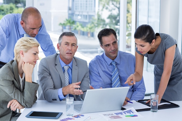 Business team working together on laptop