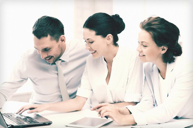 business team working with tablet pc and laptop in office