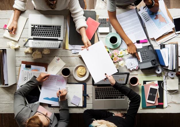 business team working at workspace in aerial view