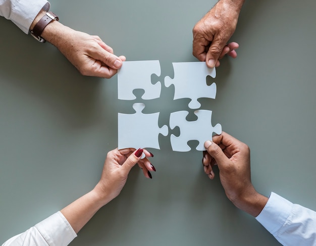 Photo business teamwork cooperation jigsaw isolated