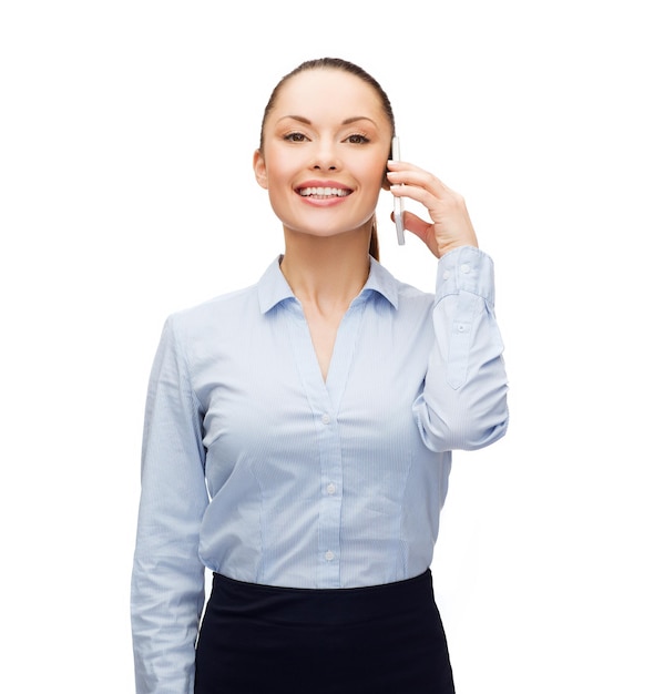 business, technology and education concept - friendly young smiling businesswoman with smartphone