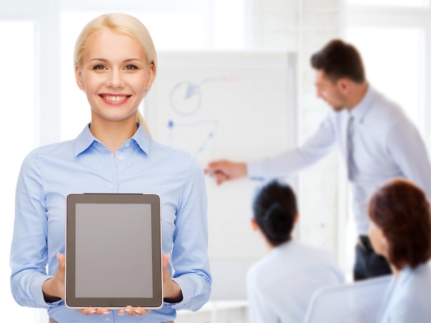 business, technology, internet and advertisement concept - smiling businesswoman with blank black tablet pc computer screen