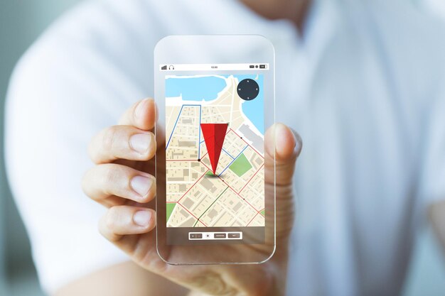 business, technology, navigation, location and people concept - close up of male hand holding and showing transparent smartphone with gps navigator map