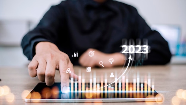 Business and Technology target set goals and achievement in 2023 new year resolution statistics graph rising revenue planning to start up strategy icon concept