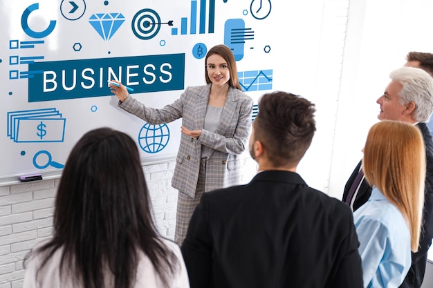 Business trainer giving lecture in conference room