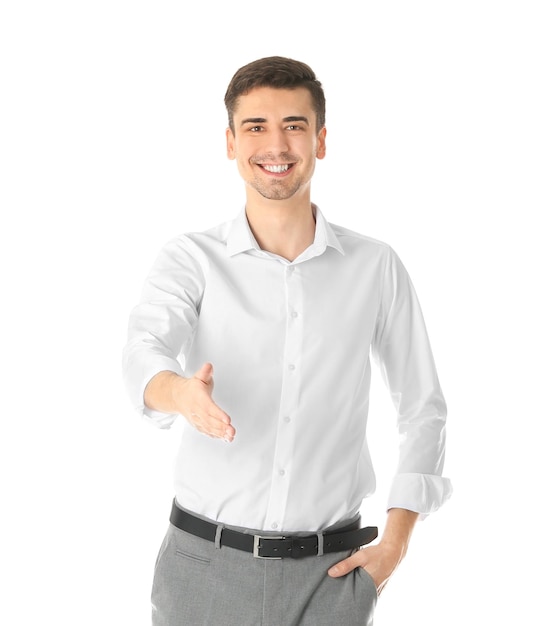 Business trainer reaching out for handshake on white background