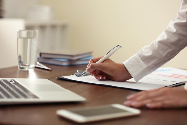 Business trainer working at table in office closeup