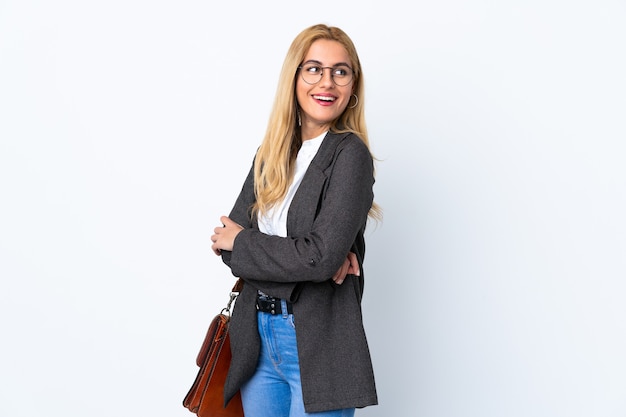 Business Uruguayan woman over isolated white background laughing