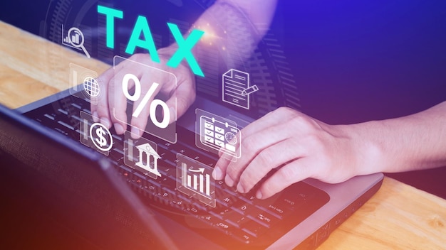 Business using computer to complete Individual income tax return form online for tax payment Government state taxes Data analysis paperwork financial research Calculation tax return