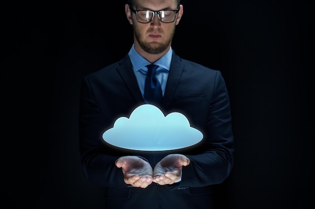 business, virtual reality, future technology, cyberspace and people - businessman with cloud projection over black background