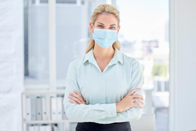 Business woman arms crossed and covid in modern office compliance bacteria safety or virus security Portrait employee and worker in medical face mask Canada company or financial planning startup