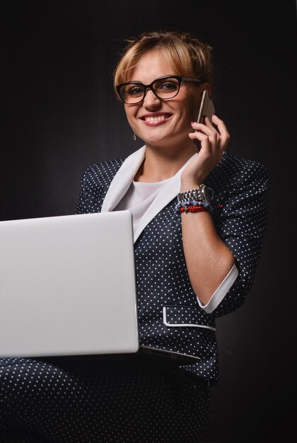 Business woman on black surface