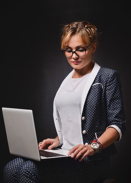 Business woman on black surface