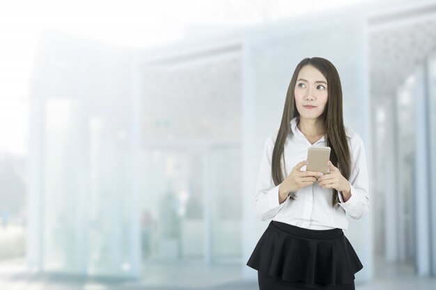 Business woman chatting by mobile phone.