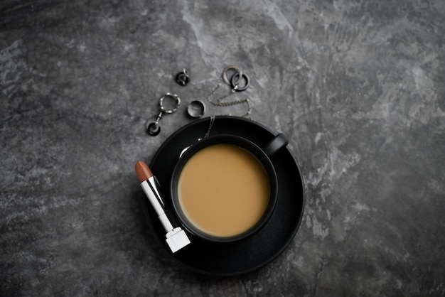 business woman coffee cup, jewelry and lipstick