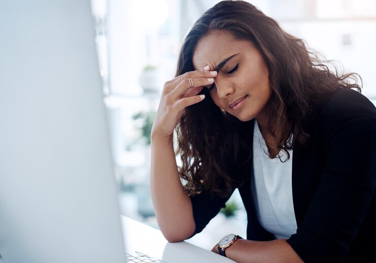 Photo business woman computer and headache with stress debt or mistake in burnout at office frustrated female person or employee with migraine anxiety or depression in financial crisis at workplace