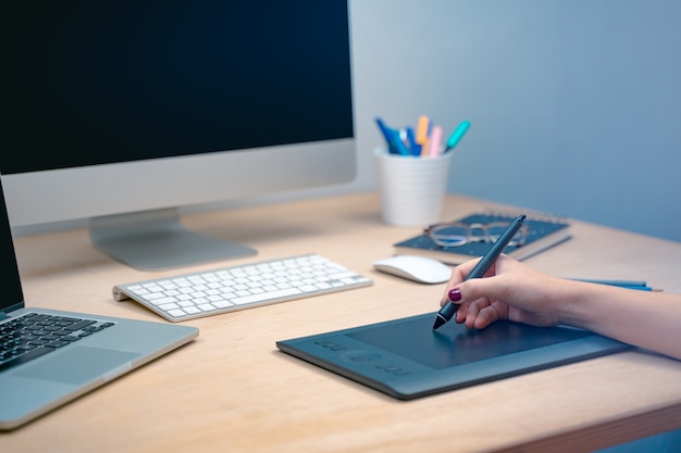 Business woman computer on her office Morning at a creative studio Graphic design mock up screens