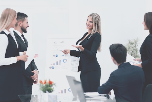 Business woman doing a presentation to his business team