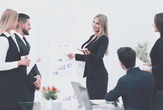 Business woman doing a presentation to his business team