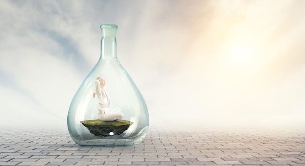 Business woman doing yoga in lotus pose inside glass bottle