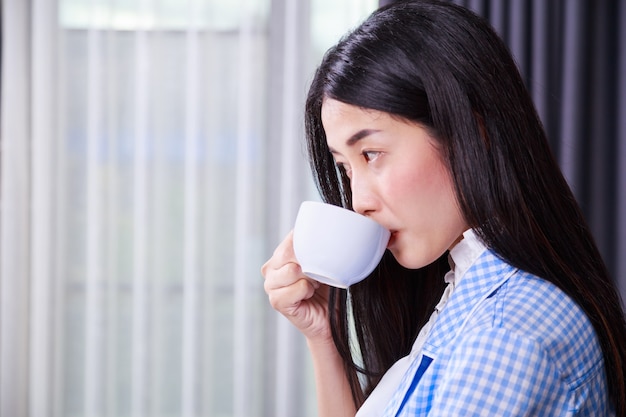 business woman drinking coffee or tea cup