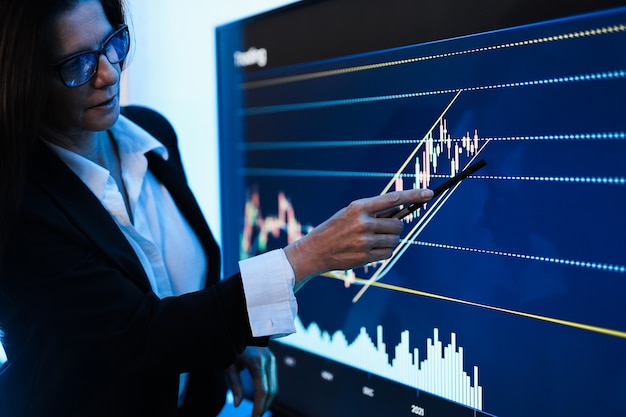 Business woman explaining trading strategies inside bank meeting room 