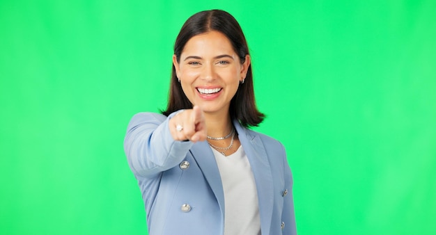 Business woman face and point at you by green screen with smile for recruitment choice and hiring opportunity Businesswoman pointing and mock up portrait for human resources by studio background