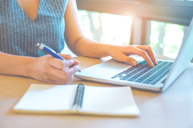 Business woman hand working with a laptop 