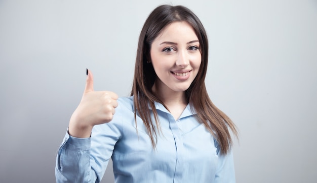 Business woman hands shows thumbs up.