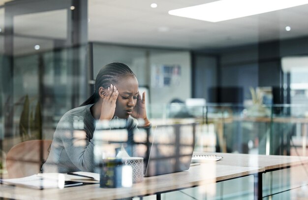 Photo business woman headache and stress in office with anxiety and burnout from work deadline tech fatigue and tired african female person at company with glass and worker feeling frustrated from fail