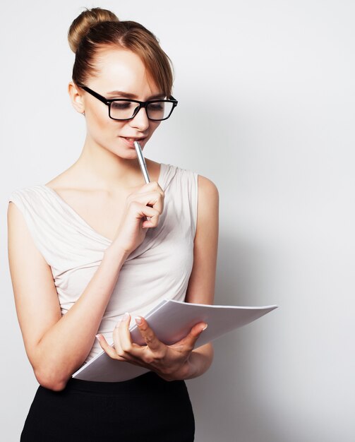 Business woman hold pages of paper