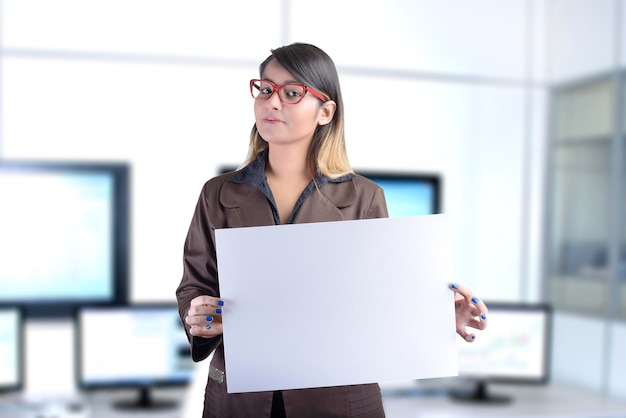 Business Woman Holding a Blank Billboard