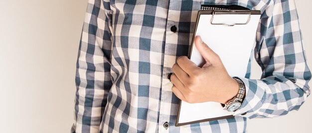 Business woman holding a clipboard. Business concept.