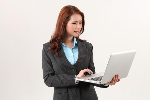 Business woman holding a laptop