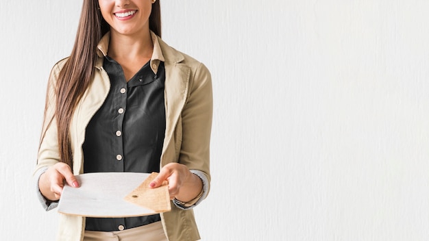 Business woman holding papers with white background