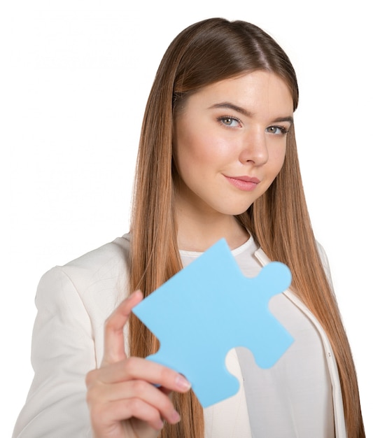 Business woman holding  puzzle piece