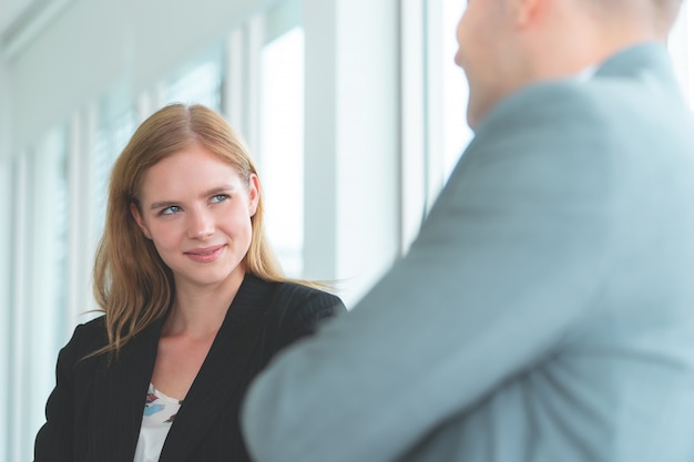 Business woman is flirting with big boss at work