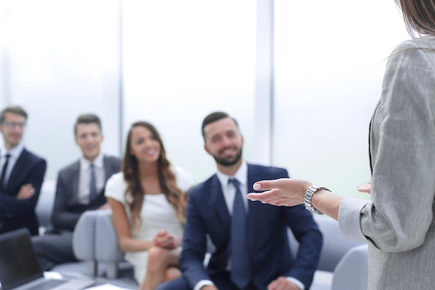 Business woman makes a report for the business team