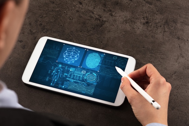 Photo business woman making analyses and checking fingerprints on tablet