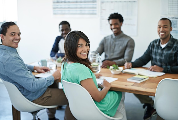 Business woman in a meeting with colleagues and team for planning talking strategy and brainstorming in the boardroom Portrait of a female employee discussing work and ideas during a workshop